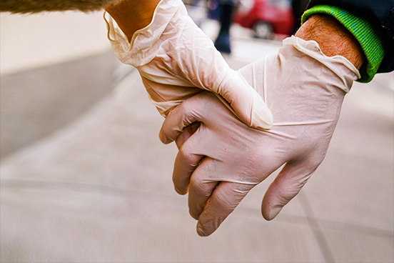 Two gloved hands holding