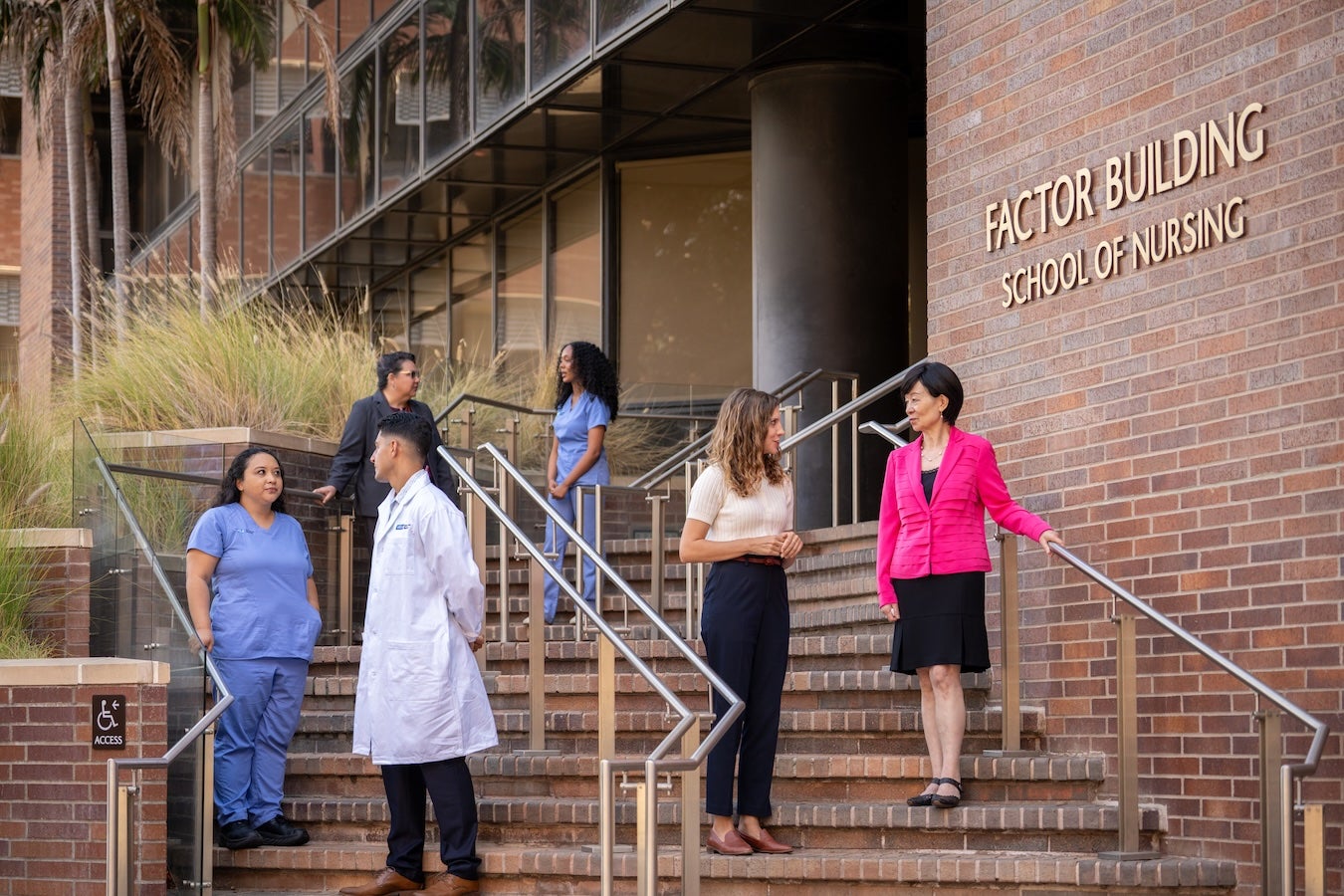 Students and staff on steps