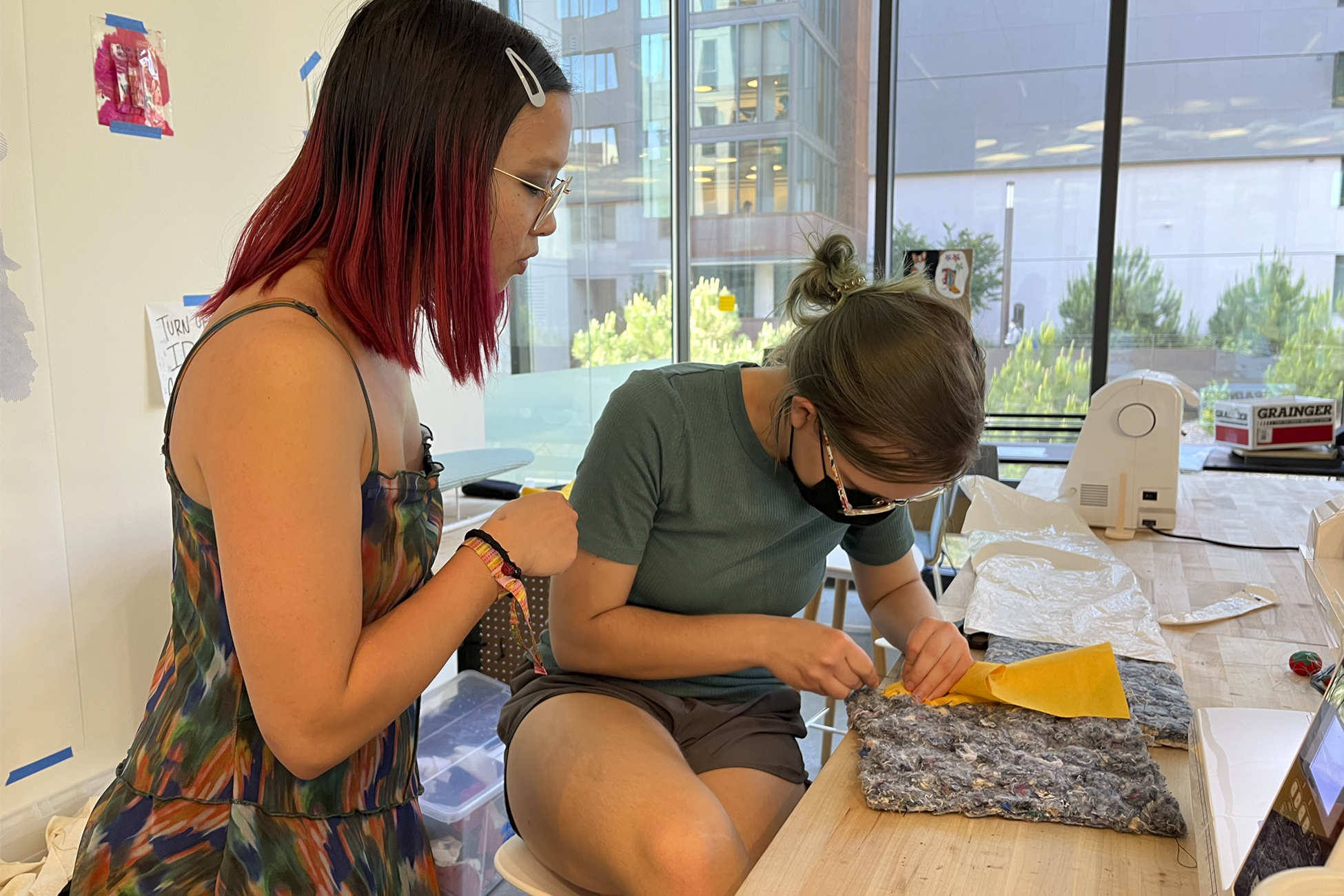 Two female students making and designing something at the UCLA MakerSpace on campus