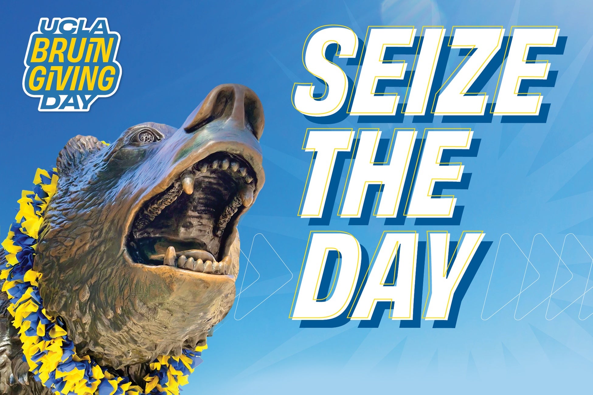 Image of UCLA Bruin Bear Statue with celebratory blue and gold lei