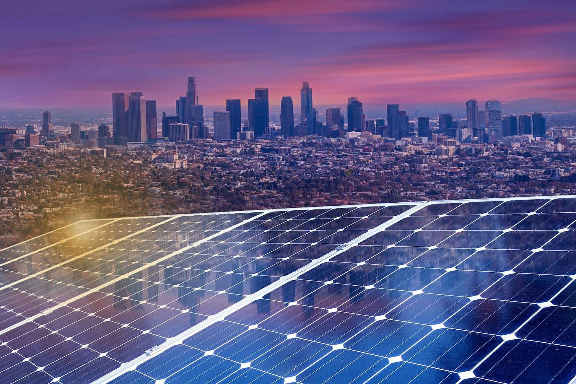 Photo of solar panels with the LA skyline in the background