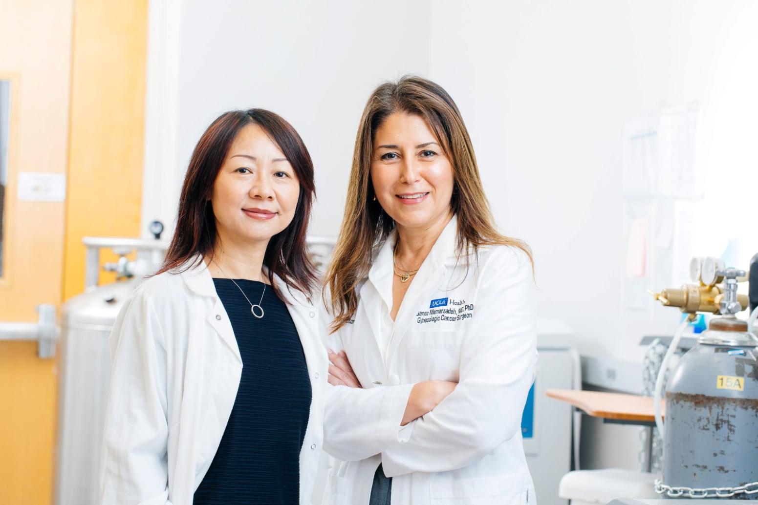 Lili Yang and Sanaz Memarzadeh in white UCLA lab coats