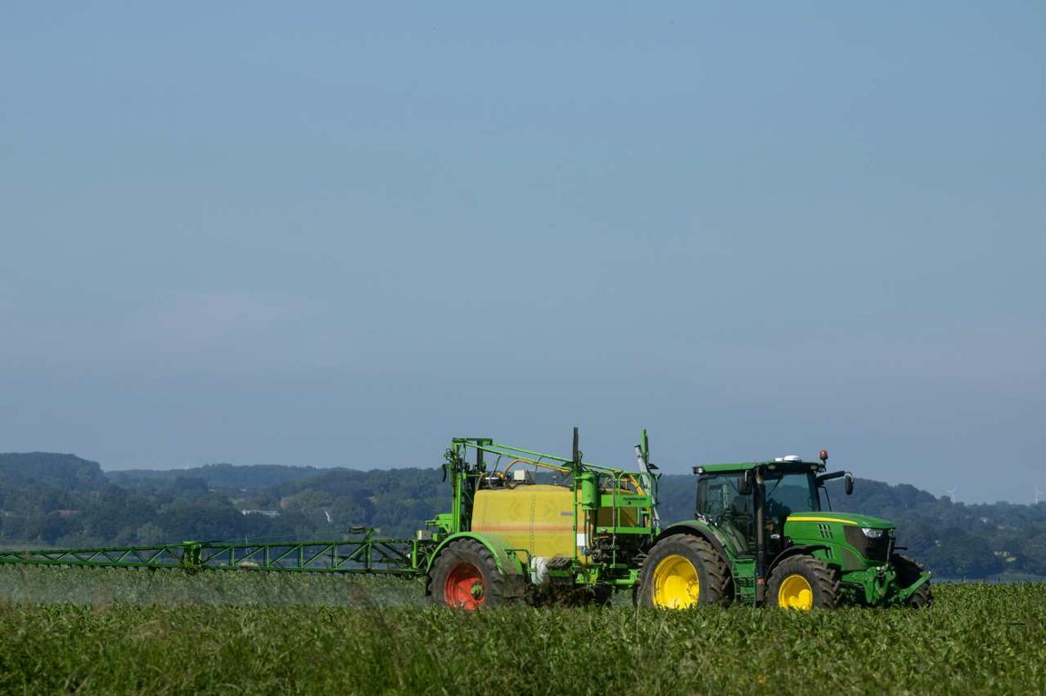 Green-and-yellow tractor in a field