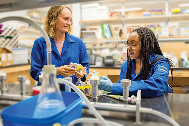 UCLA professor Jennifer Jay in the lab with a student