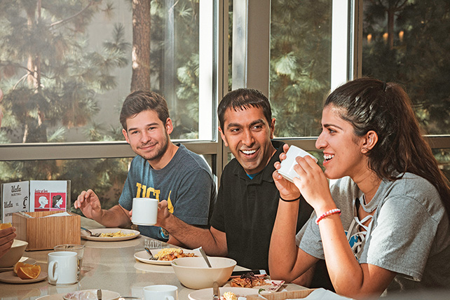 UCLA professor Neil Garg dining with students
