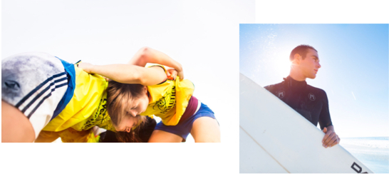 Two female wrestlers grapple with each other and a male surfer looks out to sea.
