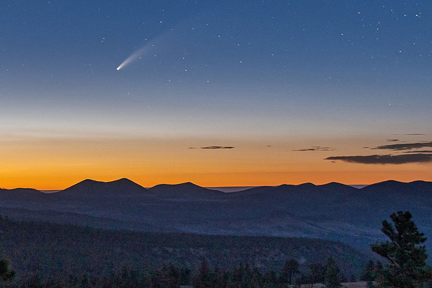 A landscape of the sky with a comet